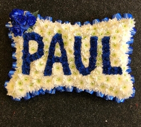Paul in flowers on pillow