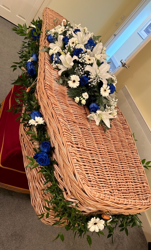 Blue and white garland and coffin spray