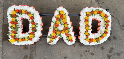 Dad mixed spray roses in centre