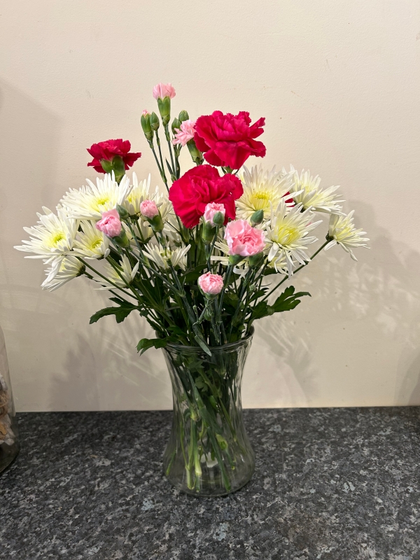 Flowers wrapped in shop paper