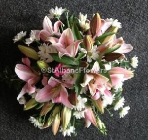 Posy arrangement with pink lilies