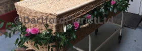 Pink rose garland for wicker coffin