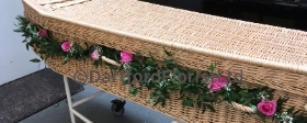 Pink rose garland for wicker coffin