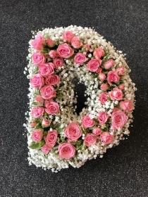 Pink rose and Gyp letter D