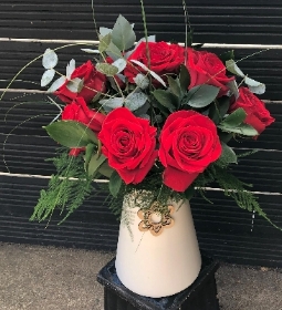 Eco dozen red roses in a vase