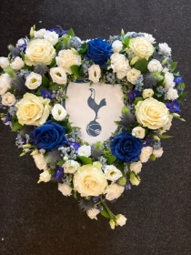 Heart with football logo in the middle.