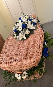 Blue and white garland and coffin spray