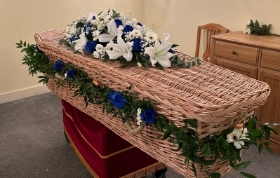 Blue and white garland and coffin spray