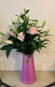 Eco vase of Lillies and roses.