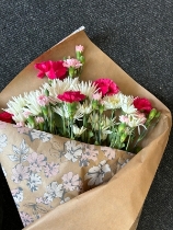 Flowers wrapped in shop paper