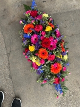 Vibrant coffin spray